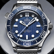 A close-up of the face of the Omega Seamaster Diver 300M 60 Years Of James Bond watch.